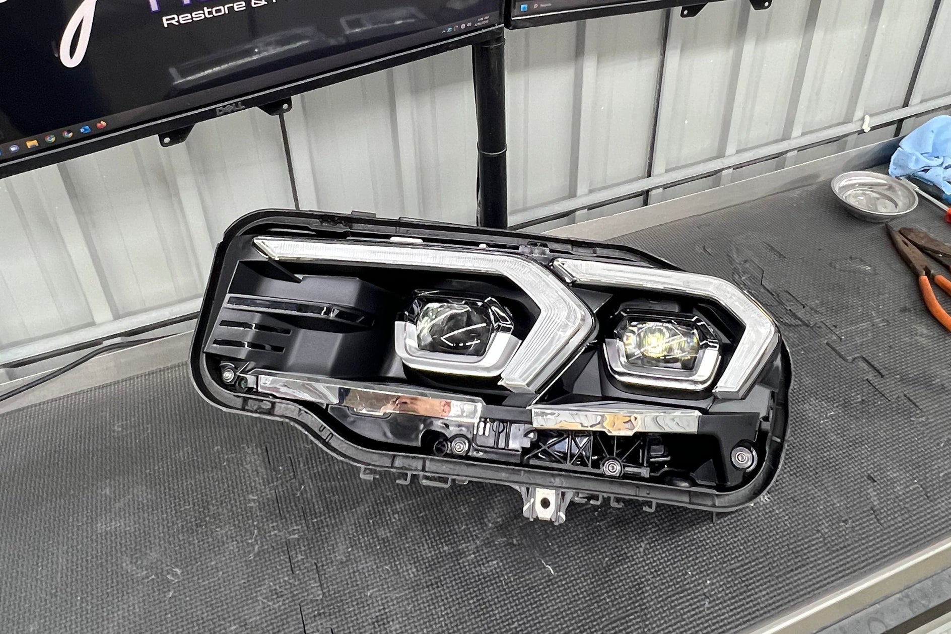 BMW headlight lens replacement before and after — crystal clear result